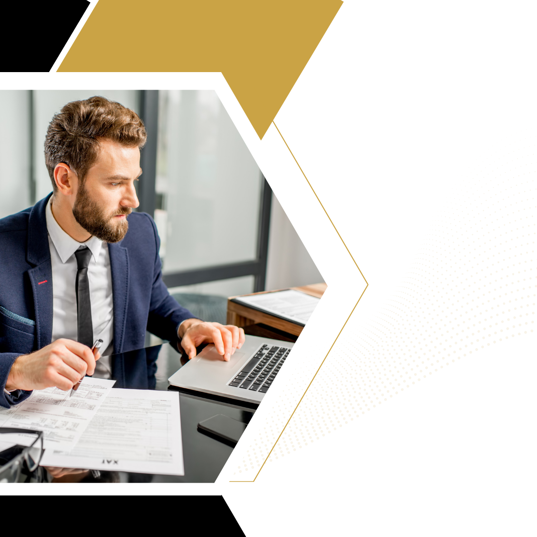 man working at computer on taxes