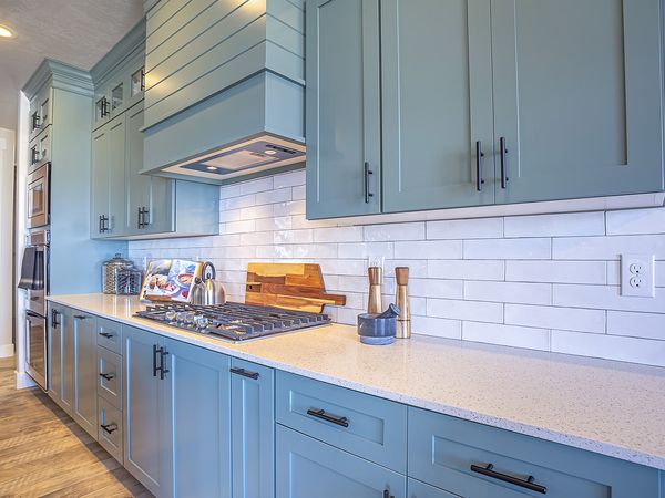 modern farmhouse style kitchen with light blue cabinets