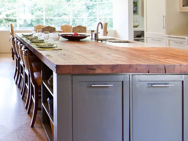 close up of a kitchen island with dark grey cabinets