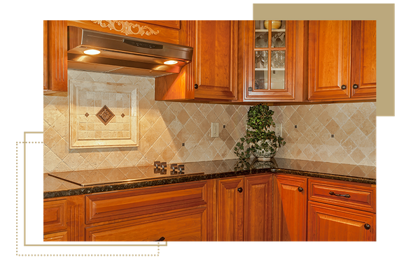 photo of walnut cabinets and Tuscan style backsplash