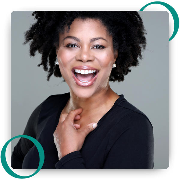 Woman showing her white teeth with an open-mouth smile