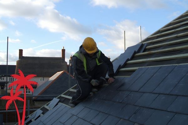 Roofer repalcing a roof.