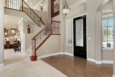 open-concept-showcases-the-updated-stairwell-entry-and-kitchen-west-designs-full-service-k-b-designer-builder-img~121193490f00eee1_8-4332-1-35b0c48.jpg