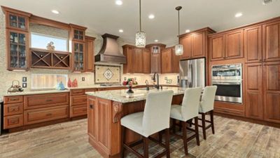 traditional-cherry-cabinets-by-schuler-custom-copper-hood-west-designs-full-service-k-b-designer-builder-img~d7f10c620f00eec9_8-6572-1-7724209_Z1UeuV8.jpg