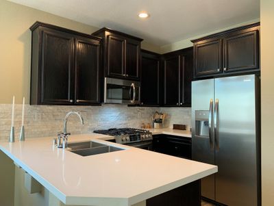 painted-existing-cabinets-new-appliances-and-counters-and-split-face-qtz-splash-west-designs-full-service-k-b-designer-builder-img~6ab117f20e851892_8-6173-1-be3cb1a.jpg