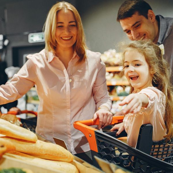 parents and little girl at grocery store How Lee H Moultrie & Associates LLC Simplifies Your Life Insurance Choices 4.jpg