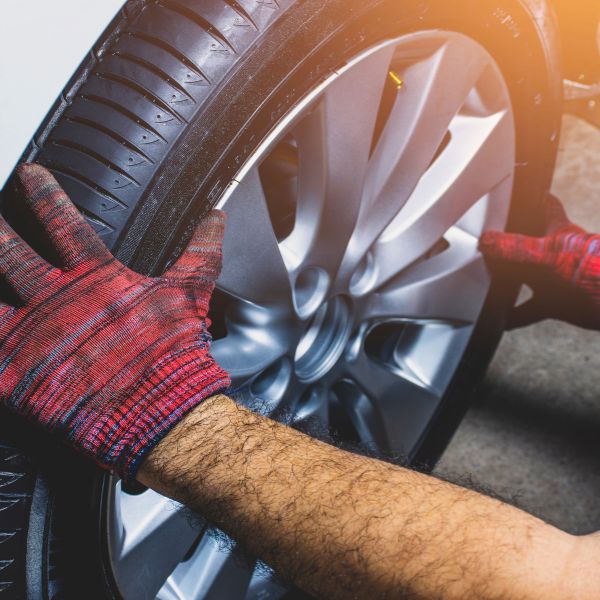 repaired wheel going back on a car