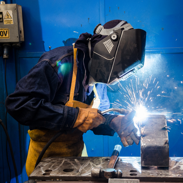 welder decked out in safety gear. 