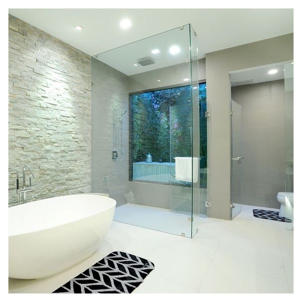 glass enclosed shower in a large bathroom