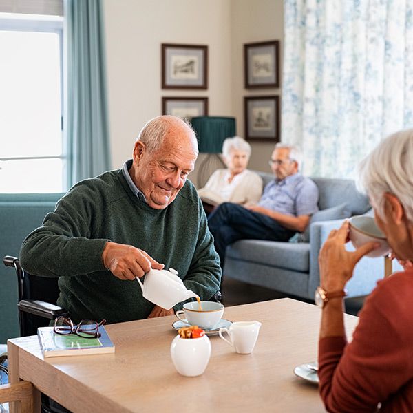 elderly couple having tea