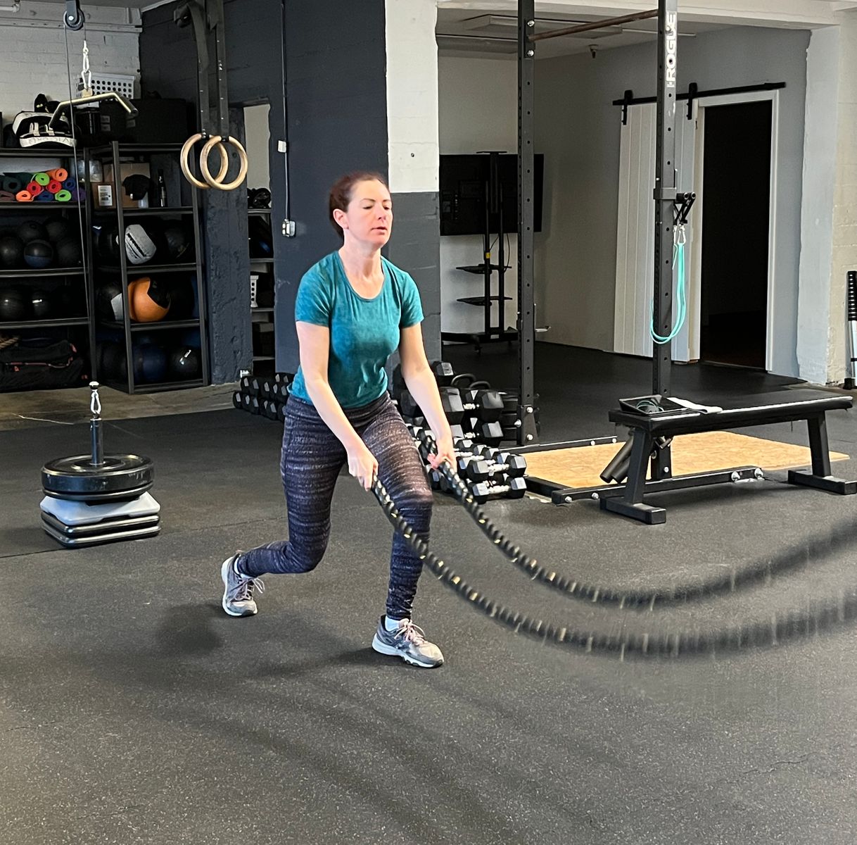 Woman working out with TRX ropes