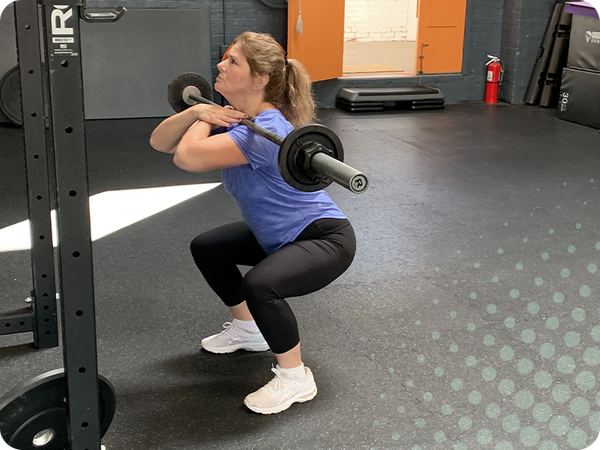 photo of woman doing squats