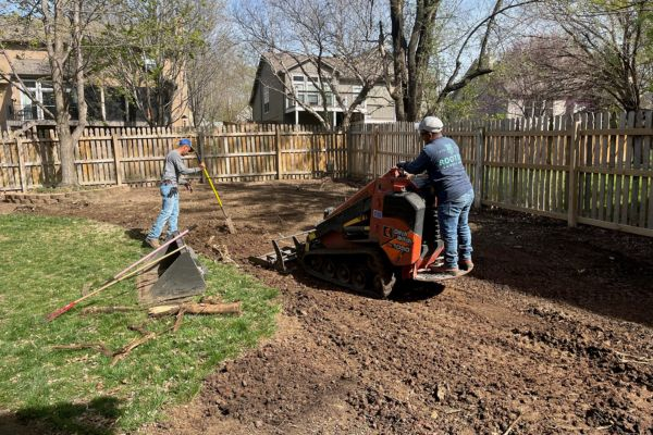 Landscapers preparing yard for sod