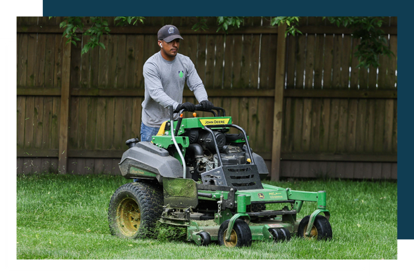 image of a man mowing