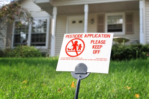 Pesticide warning sign in yard