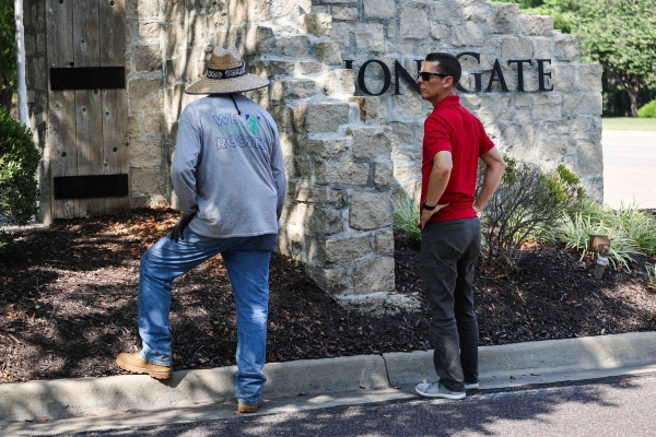 Landscaper working with a property owner