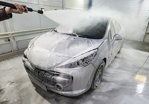 Photo of a car getting a decontamination wash