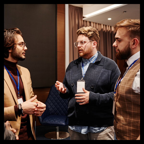 people conversing at event 