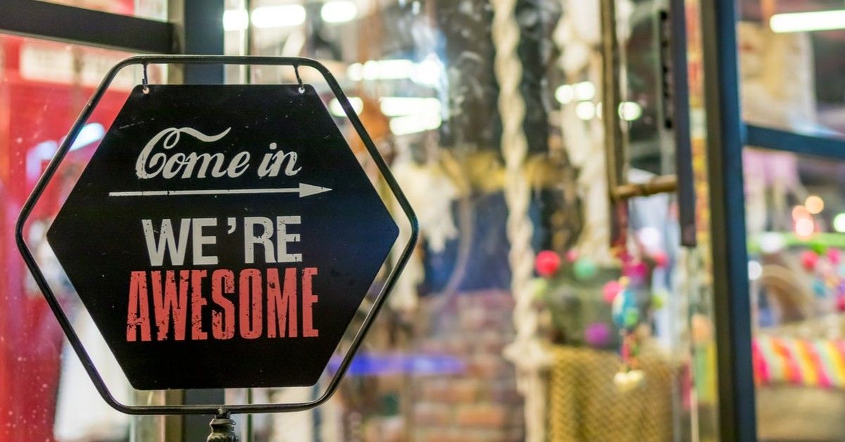 vintage business sign that says come in we're awesome