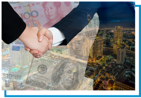 businessmen shaking hands with international money silouette 