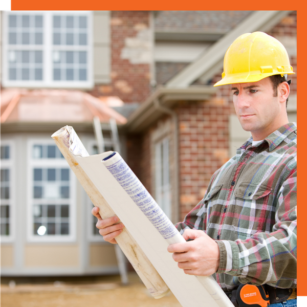 A contractor going over blueprints