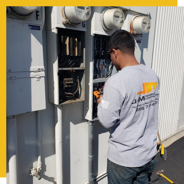 electrician works on panel