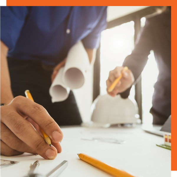 Contractors overlooking blueprints 