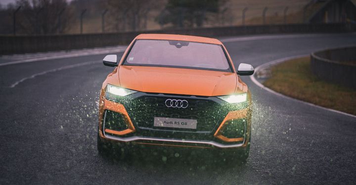 Rolling shot of an Audi RS Q8 in the rain