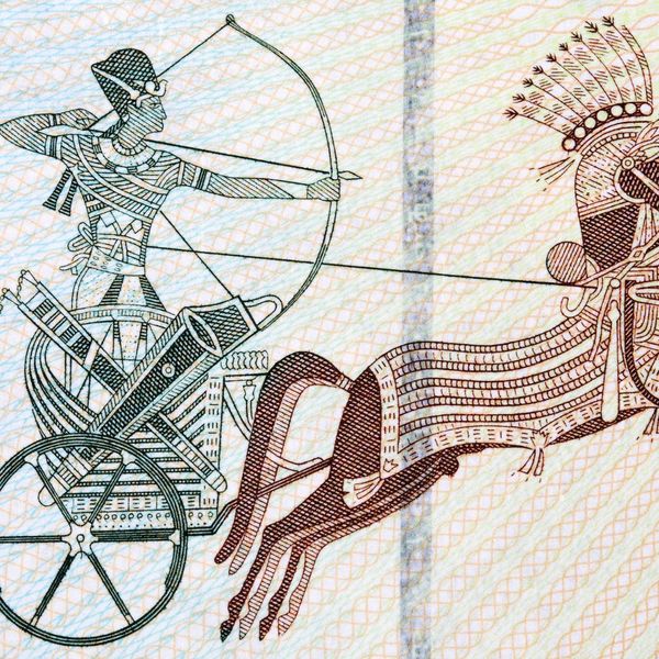 ancient drawing of a man on a chariot