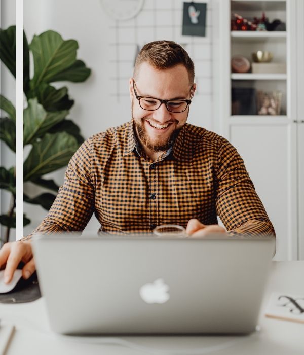 A Man Using Laptop while Sitting
