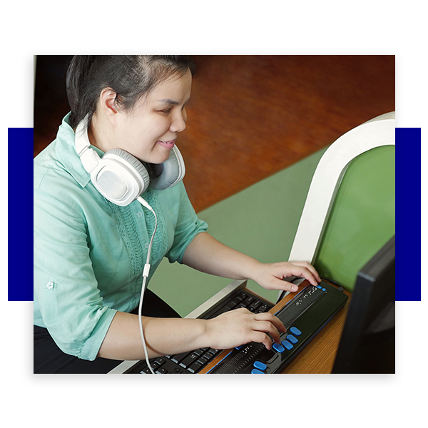 photo of blind woman working on a modified computer