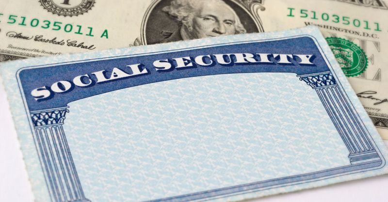 social security card in front of money