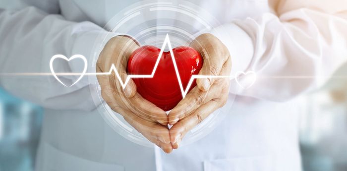 nurse holding heart graphic 