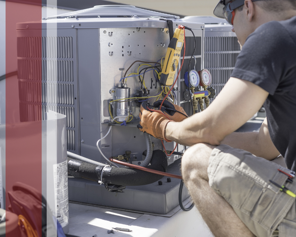 HVAC tech working on a unit