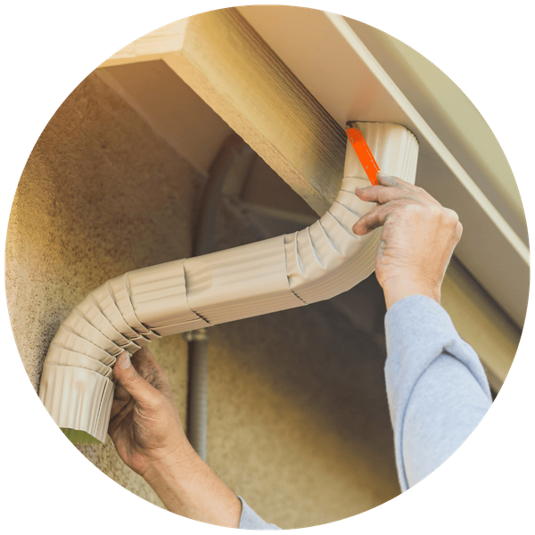 gutter being installed onto home