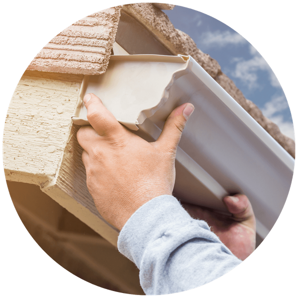 gutter being installed onto home