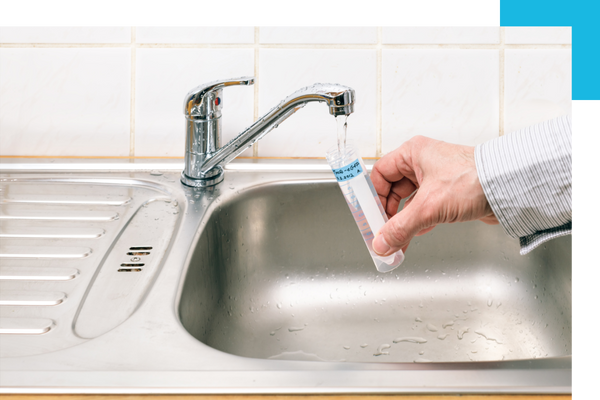 pouring water from tap into vial