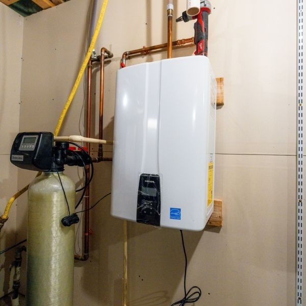 Residential tankless water heater installation and plumbing setup.