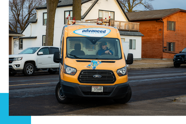 An Advanced Plumbing Systems van pulling out of driveway An Advanced Plumbing Systems van pulling out of driveway