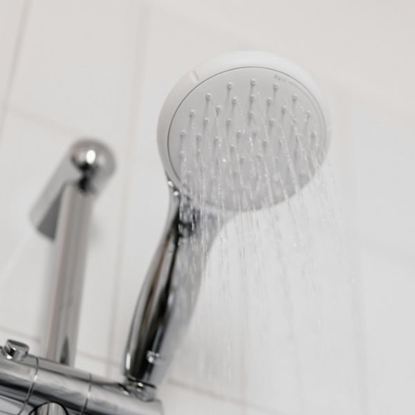 Continuous hot water from a shower head