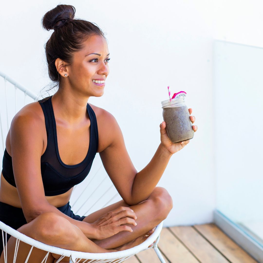 woman enjoying a fresh smoothie