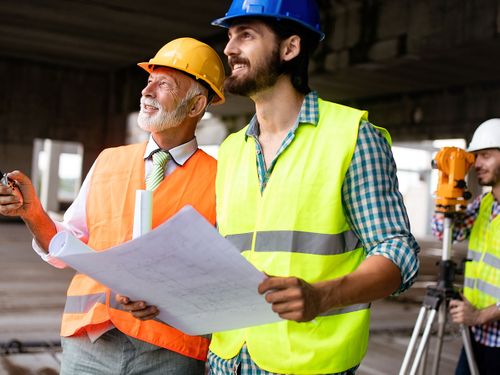 A team of contractors checking documents and business workflow.