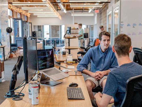 Employees collaborating in a modern office space.