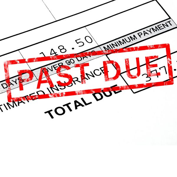 A bill with a red stamp on it that reads “past due.