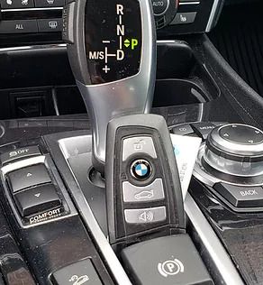 BMW key fob placed near the shifter