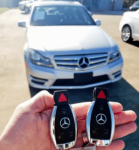 Silver Mercedes with two key fobs