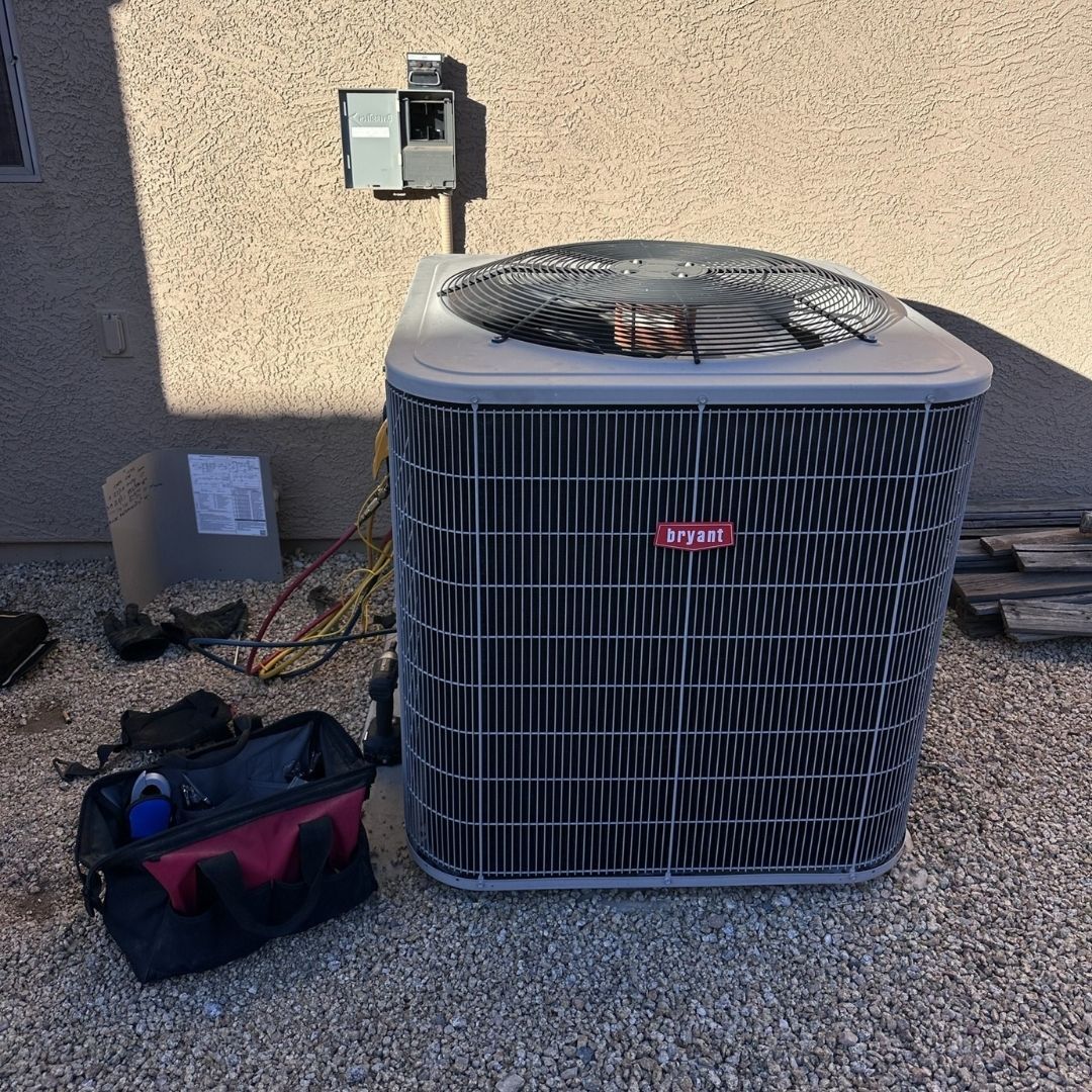 bryant AC unit with repair bag next to it