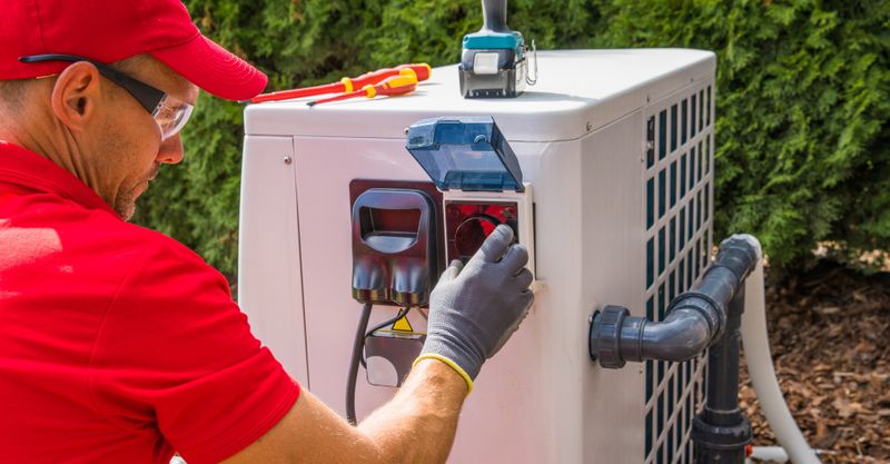 image of an HVAC repairman