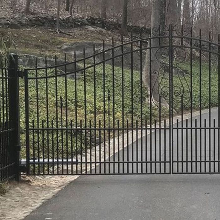 an iron gate with straight lines Why Choosing a Local Gate Contractor Matters for Your Next Project (2).jpg
