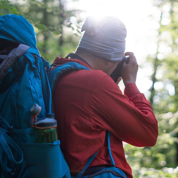 a hiker taking a picture of nature